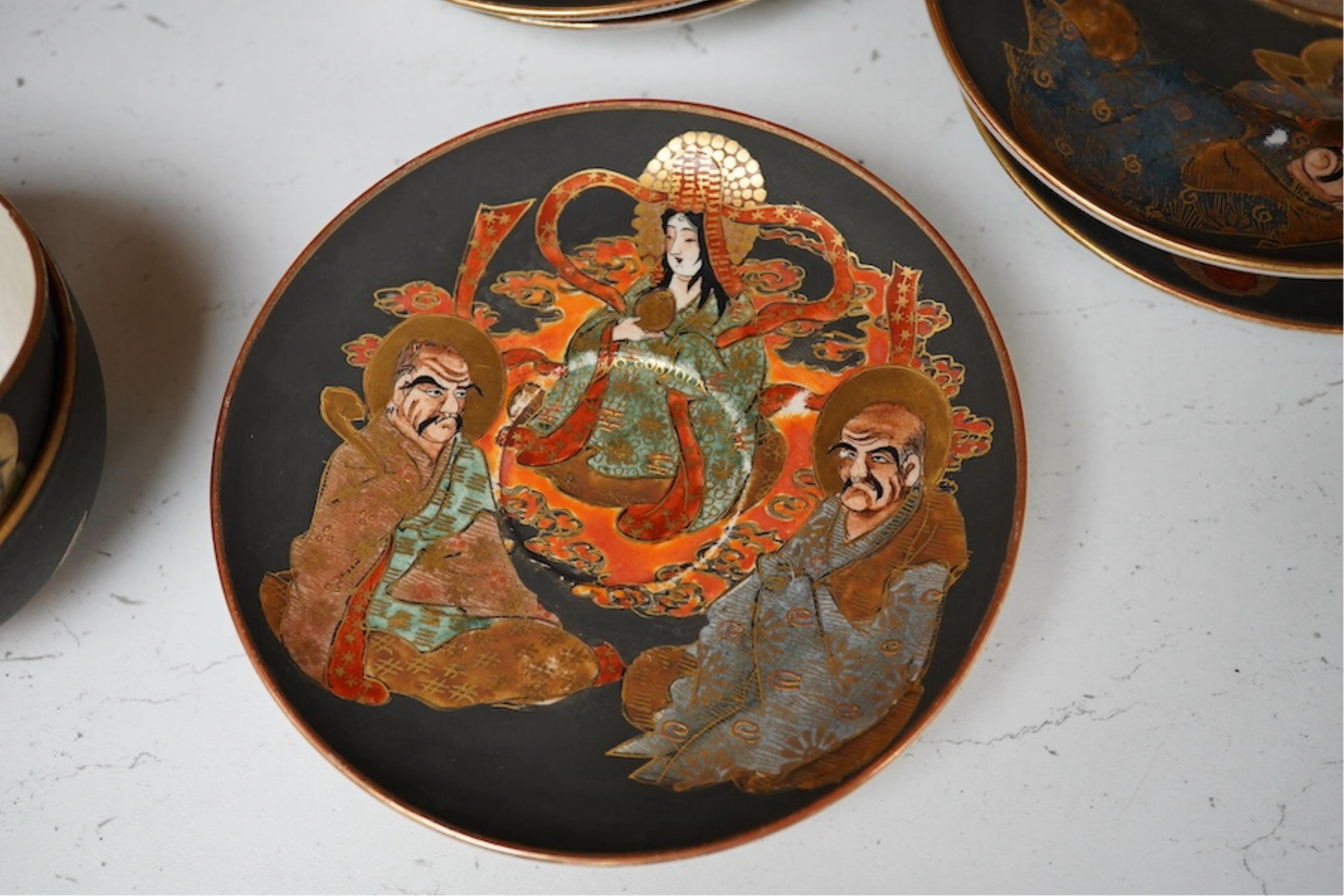 A Japanese Satsuma pottery enamel decorated tea set with Kwannon and rakan, teapot and cover 18cm high. Condition - one cup missing, one cup cracked